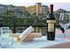 Relaxing view from an outdoor restaurant with water feature and a bottle of wine at 45 Moltrasio Ln, Henderson, NV 89011