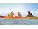 People kayaking in the serene lake within the community, enjoying water activities and the views at 45 Moltrasio Ln, Henderson, NV 89011
