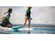 Person wake surfing while guided by another person in a community featuring water activities at 45 Moltrasio Ln, Henderson, NV 89011
