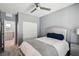 Cozy bedroom with neutral walls, a modern ceiling fan, and a door leading to another room at 5 Vicolo Loren, Henderson, NV 89011