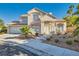 Two-story house with a landscaped front yard and attached garage at 8209 Crows Nest Ln, Las Vegas, NV 89128