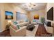 Comfortable living room features stylish furniture, modern art, and natural light at 1200 Golf Club Dr, Laughlin, NV 89029