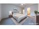Spacious main bedroom features a ceiling fan, carpet, and bedside tables at 1200 Golf Club Dr, Laughlin, NV 89029