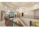 Stately foyer with grand chandelier and intricate iron staircase railing at 1309 Imperia Dr, Henderson, NV 89052