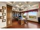 Spacious home office features custom built-ins, a coffered ceiling and abundant natural light with beautiful outdoor views at 1309 Imperia Dr, Henderson, NV 89052