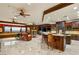 Expansive living area featuring a fireplace, a kitchen, and panoramic city views at 1309 Imperia Dr, Henderson, NV 89052