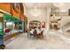 Spacious living area with a chandelier, balcony, and seamless access to an outdoor patio at 1309 Imperia Dr, Henderson, NV 89052