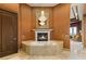 Relaxing bathroom featuring a soaking tub, a fireplace, and elegant accents for a spa-like retreat at 1309 Imperia Dr, Henderson, NV 89052