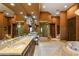 Spacious bathroom with dual vanities, a walk-in shower, a soaking tub, and elegant finishes throughout at 1309 Imperia Dr, Henderson, NV 89052