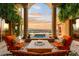 Stunning outdoor patio with a fire pit, spa, city view, and comfortable seating, perfect for relaxation at 1309 Imperia Dr, Henderson, NV 89052