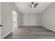 Spacious main bedroom featuring wood-look floors and ensuite bathroom at 4029 Allyson Rae St, North Las Vegas, NV 89032