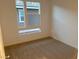 Bright bedroom featuring neutral carpeting and natural light at 874 Cottonwood Hill Pl, Henderson, NV 89011