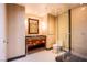 Bathroom with a modern vanity with plenty of storage, toilet, and glass enclosed shower at 2700 Las Vegas Blvd # 2702, Las Vegas, NV 89109