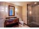 Elegant bathroom features a modern vanity, framed mirror, and a glass-enclosed shower at 2700 Las Vegas Blvd # 2702, Las Vegas, NV 89109
