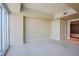 Bedroom with carpeted floors and a large window allowing ample natural light at 2700 Las Vegas Blvd # 2702, Las Vegas, NV 89109