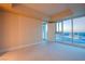Bright bedroom with floor-to-ceiling windows offering city views and plush carpeting at 2700 Las Vegas Blvd # 2702, Las Vegas, NV 89109