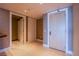 Hallway featuring tile flooring and multiple doors providing access to different areas of the home at 2700 Las Vegas Blvd # 2702, Las Vegas, NV 89109