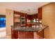 Modern kitchen featuring stainless steel appliances and a granite countertop bar area at 2700 Las Vegas Blvd # 2702, Las Vegas, NV 89109