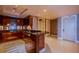 Contemporary kitchen with stainless steel backsplash, custom cabinets, and granite countertops at 2700 Las Vegas Blvd # 2702, Las Vegas, NV 89109