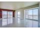 Bright, spacious living room with tile floors and floor-to-ceiling windows offering city views at 2700 Las Vegas Blvd # 2702, Las Vegas, NV 89109