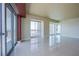 Bright open-concept living room with tile flooring and access to a balcony at 2700 Las Vegas Blvd # 2702, Las Vegas, NV 89109