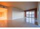 Open living area with tile floors and large windows overlooking the city skyline at 2700 Las Vegas Blvd # 2702, Las Vegas, NV 89109