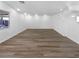 Unfurnished basement with wood-look flooring, bright white paint and natural light at 1195 Sunfire St, Henderson, NV 89014