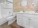 Bright bathroom with white vanity, double sinks, and a tub/shower combo at 1195 Sunfire St, Henderson, NV 89014