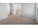 Bright bedroom boasts neutral carpet, white walls and closet with double doors at 1195 Sunfire St, Henderson, NV 89014