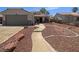 Charming one-story home with a welcoming walkway and low maintenance rock landscaping at 1195 Sunfire St, Henderson, NV 89014
