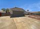 Single Gathering home with neutral stucco, tile roof, and a wide two-car garage at 1195 Sunfire St, Henderson, NV 89014