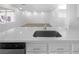 Kitchen with quartz countertops, stainless sink, and a view into a great room at 1195 Sunfire St, Henderson, NV 89014