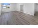 Living room showcases wood-look floors, a front door, and lots of natural light at 1195 Sunfire St, Henderson, NV 89014