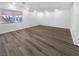 Spacious living room with wood-look floors, bright white paint and ample natural light at 1195 Sunfire St, Henderson, NV 89014