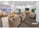 Bright living room with modern wood flooring, neutral paint and stylish contemporary furnishings at 1195 Sunfire St, Henderson, NV 89014