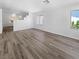 Bright living room features hard surface floors, large windows, and neutral paint colors at 1195 Sunfire St, Henderson, NV 89014