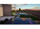 Inviting backyard with a sparkling pool, landscaped patio, and desert sunset views at 25 Canyon Bay Dr, Henderson, NV 89011