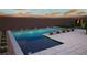 Infinity pool featuring desert views, desert landscaping, and integrated lighting at 25 Canyon Bay Dr, Henderson, NV 89011