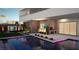 Relaxing poolside with a custom grill, desert plants, and infinity edge pool at 25 Canyon Bay Dr, Henderson, NV 89011
