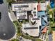 Modern home aerial view featuring solar panels, a pool, desert landscaping, and colorful sunshades at 2017 Slow Wind St, Las Vegas, NV 89134