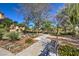 Relaxing community park with mature shade trees and park benches at 2017 Slow Wind St, Las Vegas, NV 89134