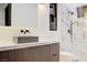 Modern bathroom featuring a sleek vanity and glass enclosed shower with tile surround at 8780 Haven St, Las Vegas, NV 89123
