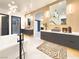 Luxurious bathroom featuring modern fixtures, a soaking tub, and elegant finishes at 8780 Haven St, Las Vegas, NV 89123