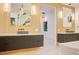 Modern bathroom showcasing double vanity sinks, wood accent wall, and a view of the soaking tub and shower at 8780 Haven St, Las Vegas, NV 89123