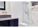Modern bathroom features a sleek vanity and a beautifully tiled shower enclosure at 8780 Haven St, Las Vegas, NV 89123