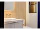 Modern bathroom features a floating vanity, and wood-look tile walls at 8780 Haven St, Las Vegas, NV 89123