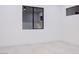 Minimalist bedroom features modern tile floors, sleek trim, and a large window offering ample natural light at 8780 Haven St, Las Vegas, NV 89123