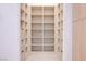 Bright walk-in closet features custom shelving and drawers for optimal storage and organization at 8780 Haven St, Las Vegas, NV 89123