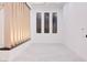 Bright empty room with modern lighting and floor to ceiling windows at 8780 Haven St, Las Vegas, NV 89123
