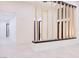 Bright entryway with modern light fixtures and custom wood and metal divider that allows light to filter through at 8780 Haven St, Las Vegas, NV 89123